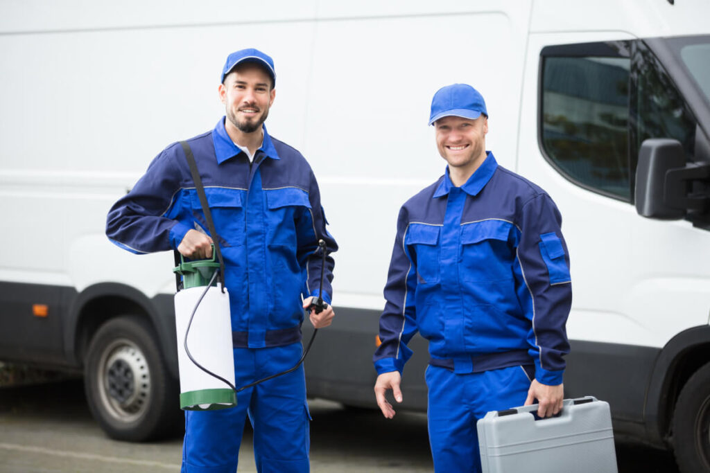 professional pest control workers happy to do their job